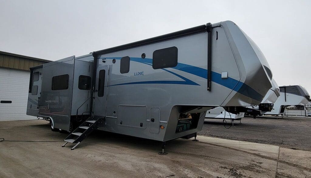 2023 Luxe 44FB Toy Hauler luxury fifth wheel with full-body paint and slide-outs