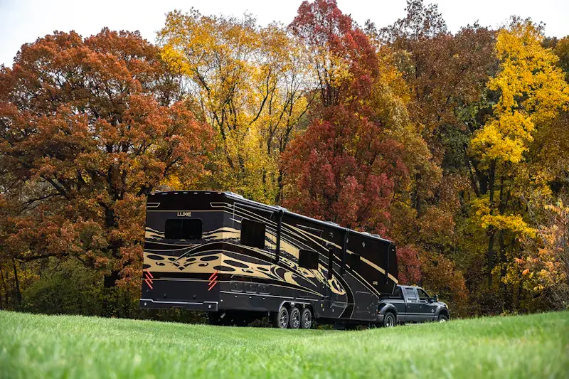 A luxury 5th wheel built by Luxe at Potato Creek State Park during Fall.