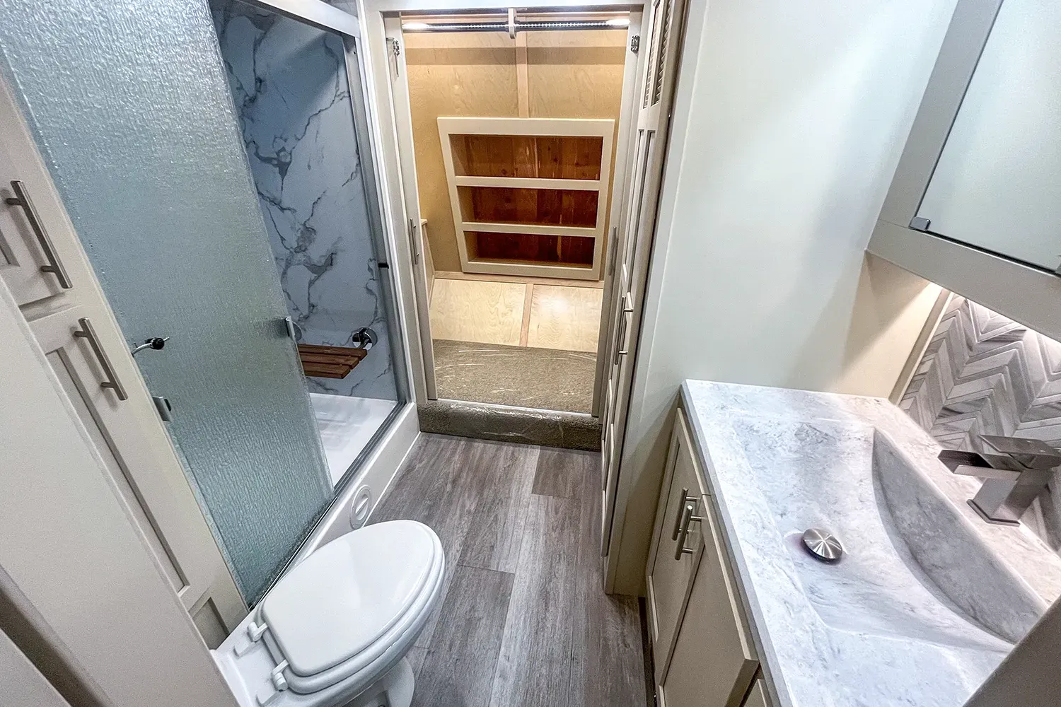 The bathroom in the master suite of the Luxe 5th Wheel Toy Hauler 46FB floor plan.