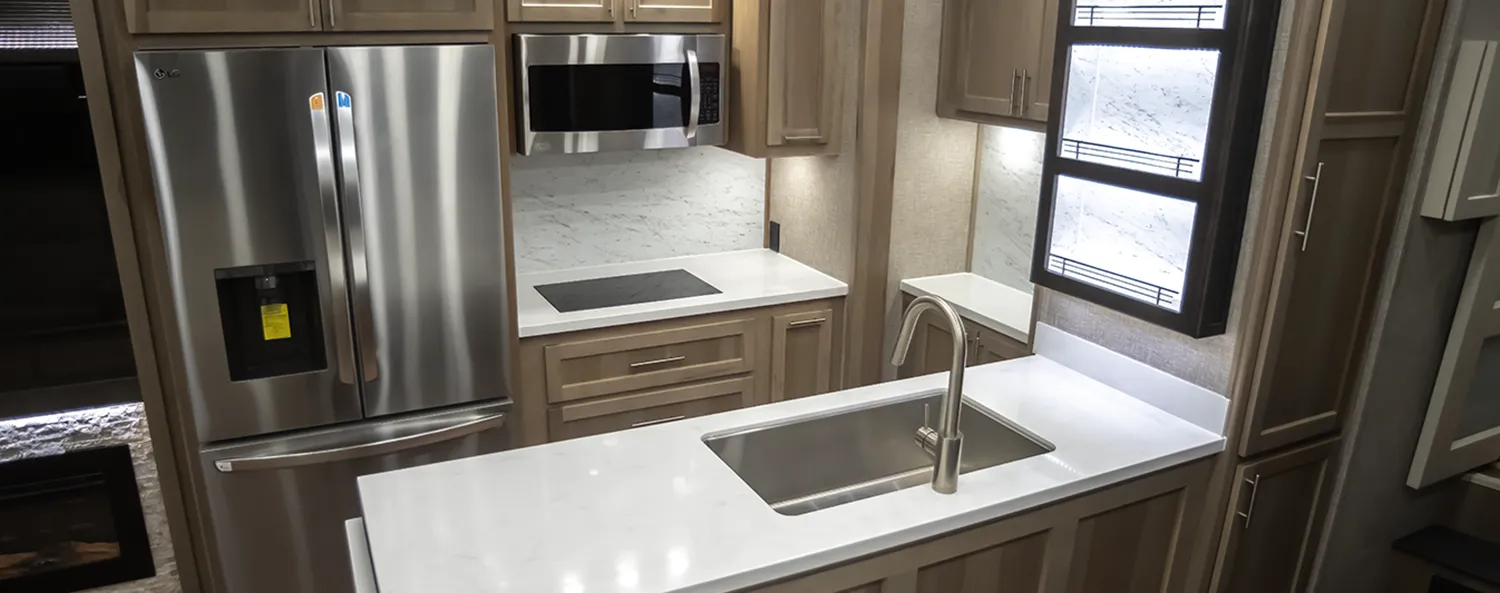 The Kitchen of a Luxe Elegante luxury fifth wheel, built by leading luxury fifth wheel company Luxe Fifth Wheel.