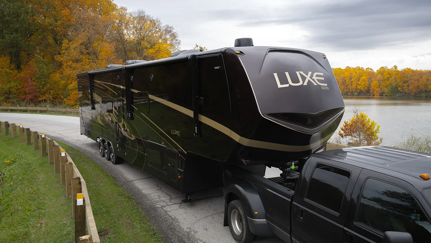 The exterior of a Luxe Elite 46RKB, a rear kitchen fifth wheel.