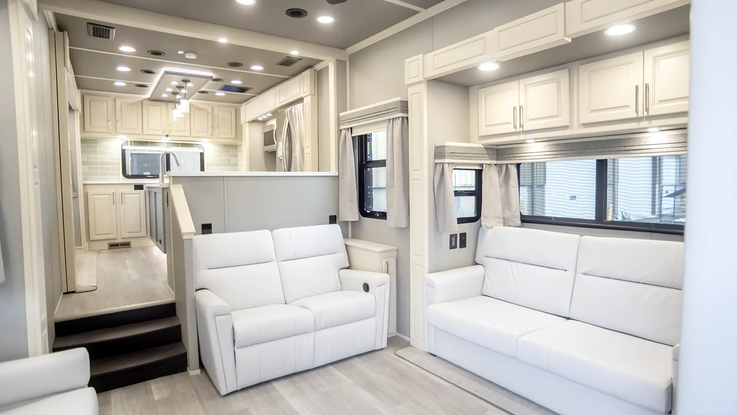 The living room of the the Luxe Elite 46RKB, a rear kitchen fifth wheel.