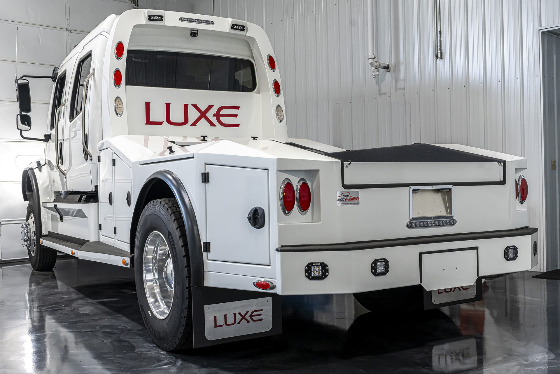 A Luxe Truck Freightliner M2 106 fifth wheel hauler truck.