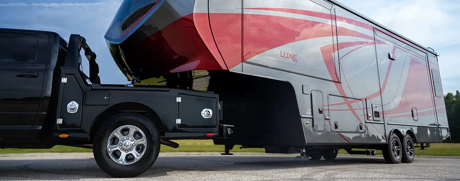 A Luxe Elegante Luxury Fifth Wheel being hauled by a Luxe Truck Dodge Ram 3500 short bed SRW. The Luxe Elegante is a Luxe in a smaller package, capable of being towed by a single rear wheel truck.