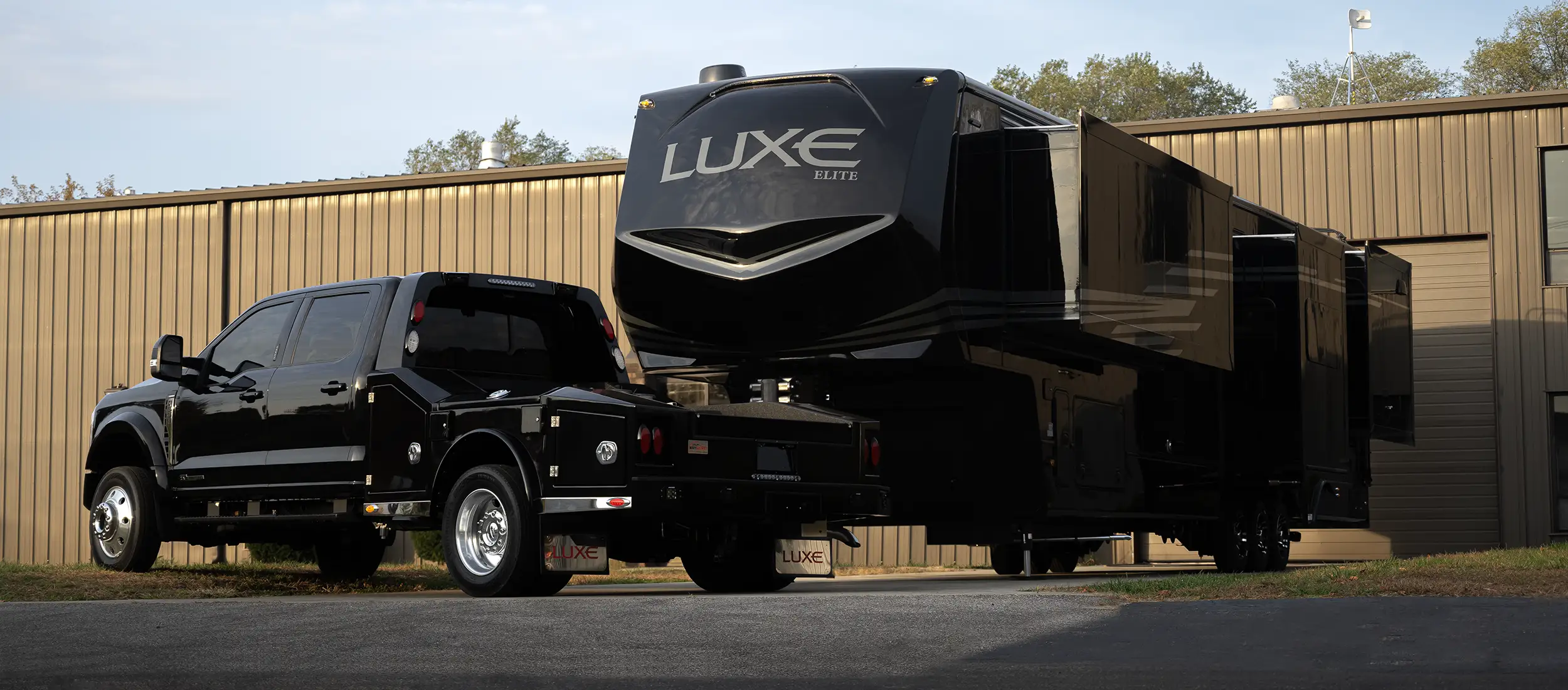 A Factory Direct Fifth Wheel built by Luxe Fifth Wheel, with a fifth wheel hauler truck by Luxe Trucks, located at The RV Factory in Elkhart Indiana.