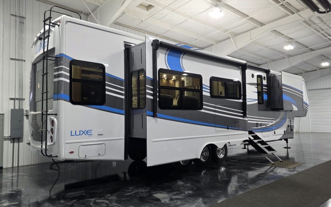 Luxe 42RL Elite fifth wheel RV with slide-outs extended, full-body paint, and ladder