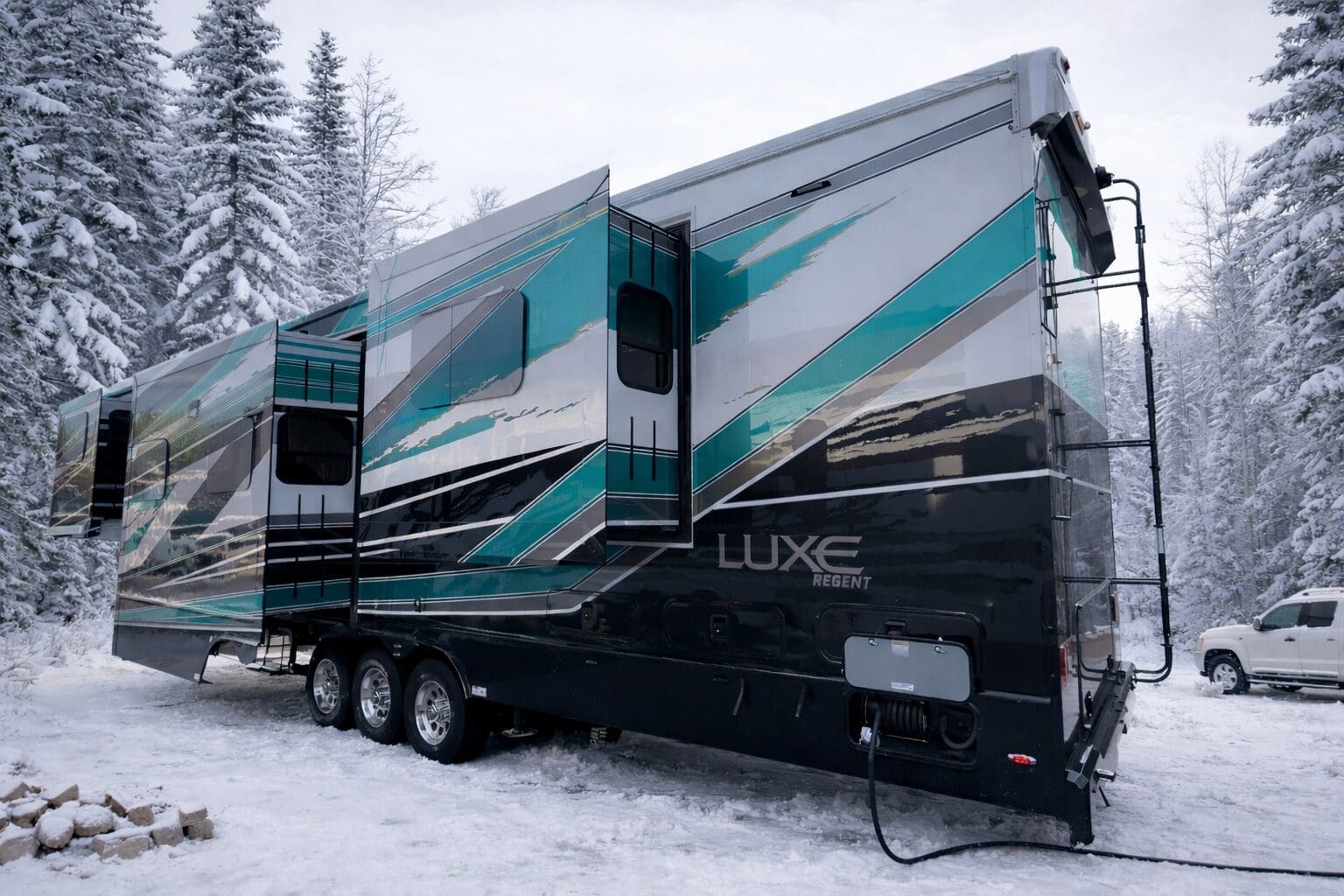 FLB_snowy_background Luxe Regent luxury fifth wheel RV with slide-outs extended in a snowy forest, ready for full-time living