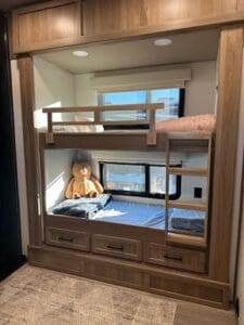 Luxe Elite luxury fifth wheel 2-bedroom bunkhouse with two twin beds, storage, and window for full-time living