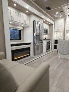 Luxe Elite 2-bedroom luxury fifth wheel kitchen with residential appliances, fireplace, and slide-out living area