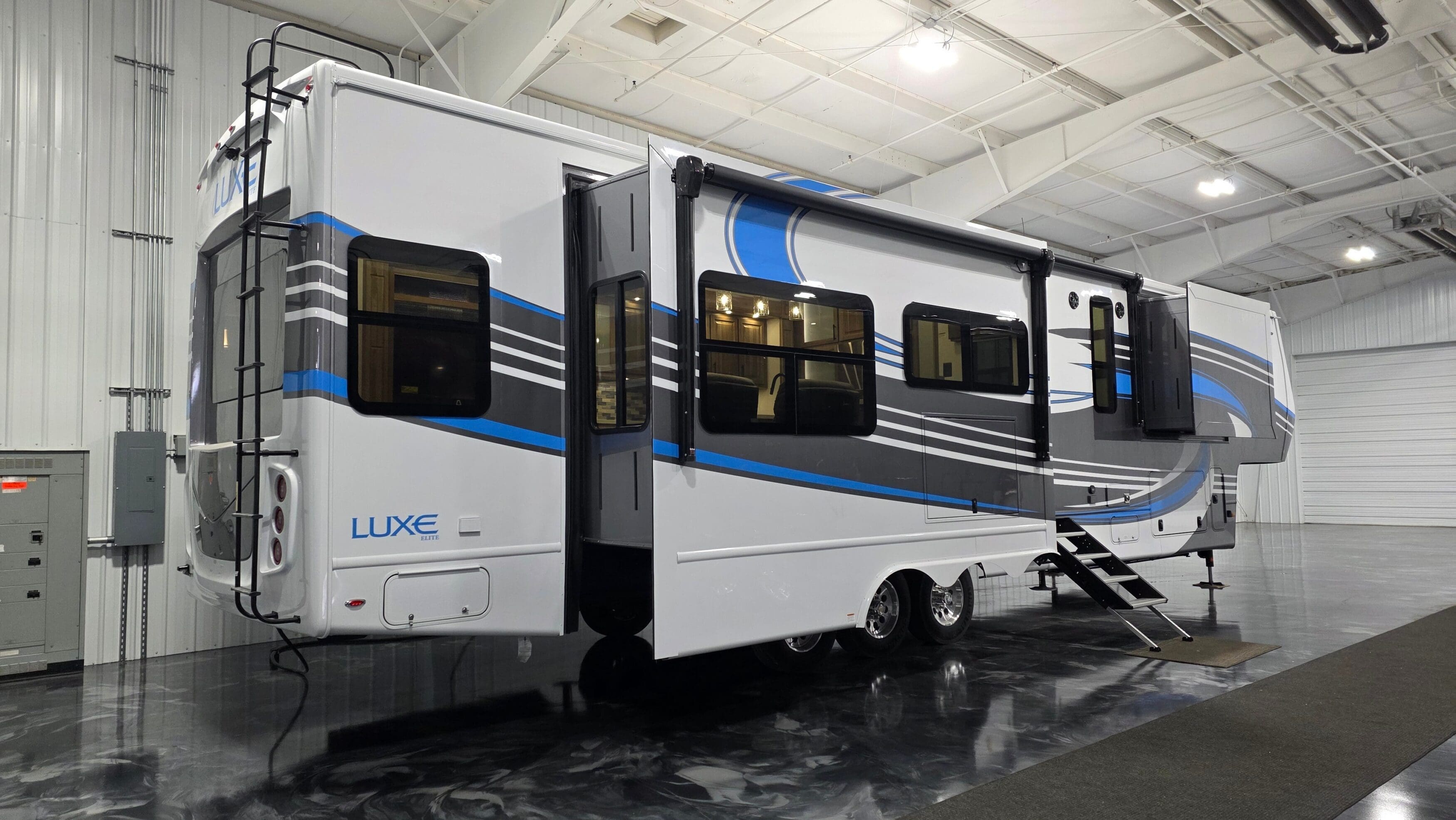 Luxe 42RL Elite luxury fifth wheel RV with slide-outs extended, full-body paint, and ladder